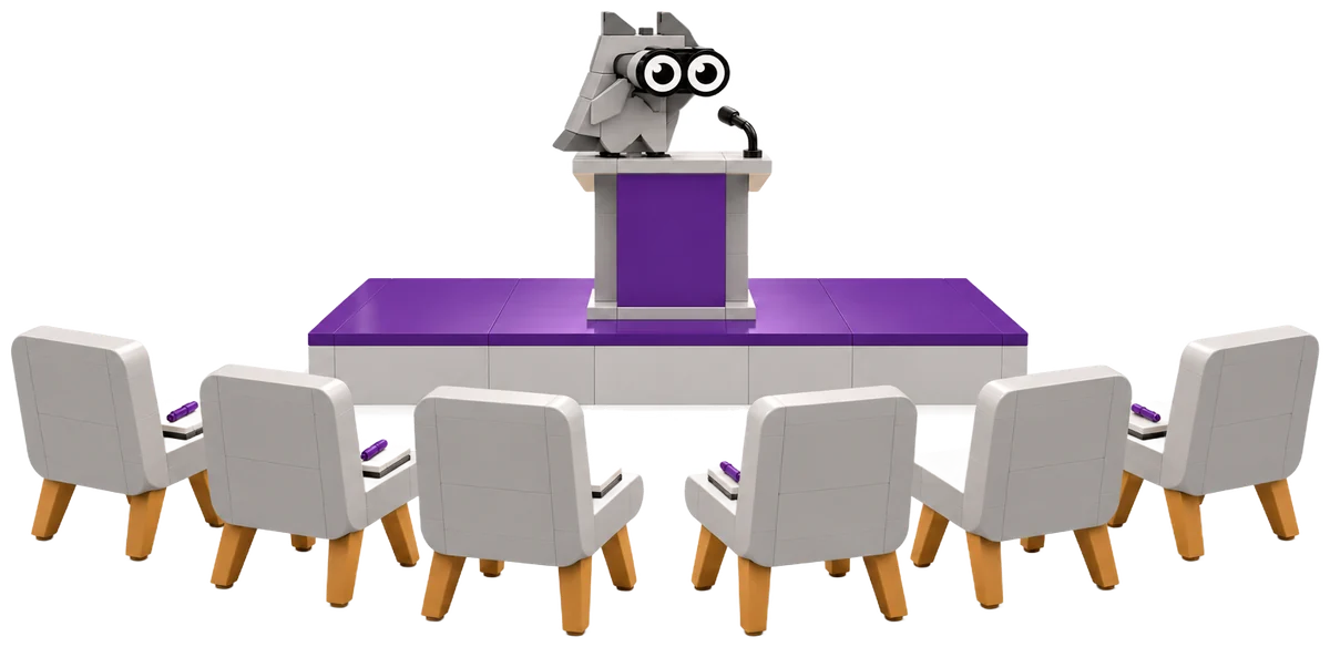 Rednerpult auf einem violetten Podest, davor Stühle im Halbkreis mit Notizbüchern, am Pult steht die EDUSOL-Eule